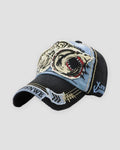 Denim blue shark patch baseball cap, three-quarter view, black crown and light blue panel