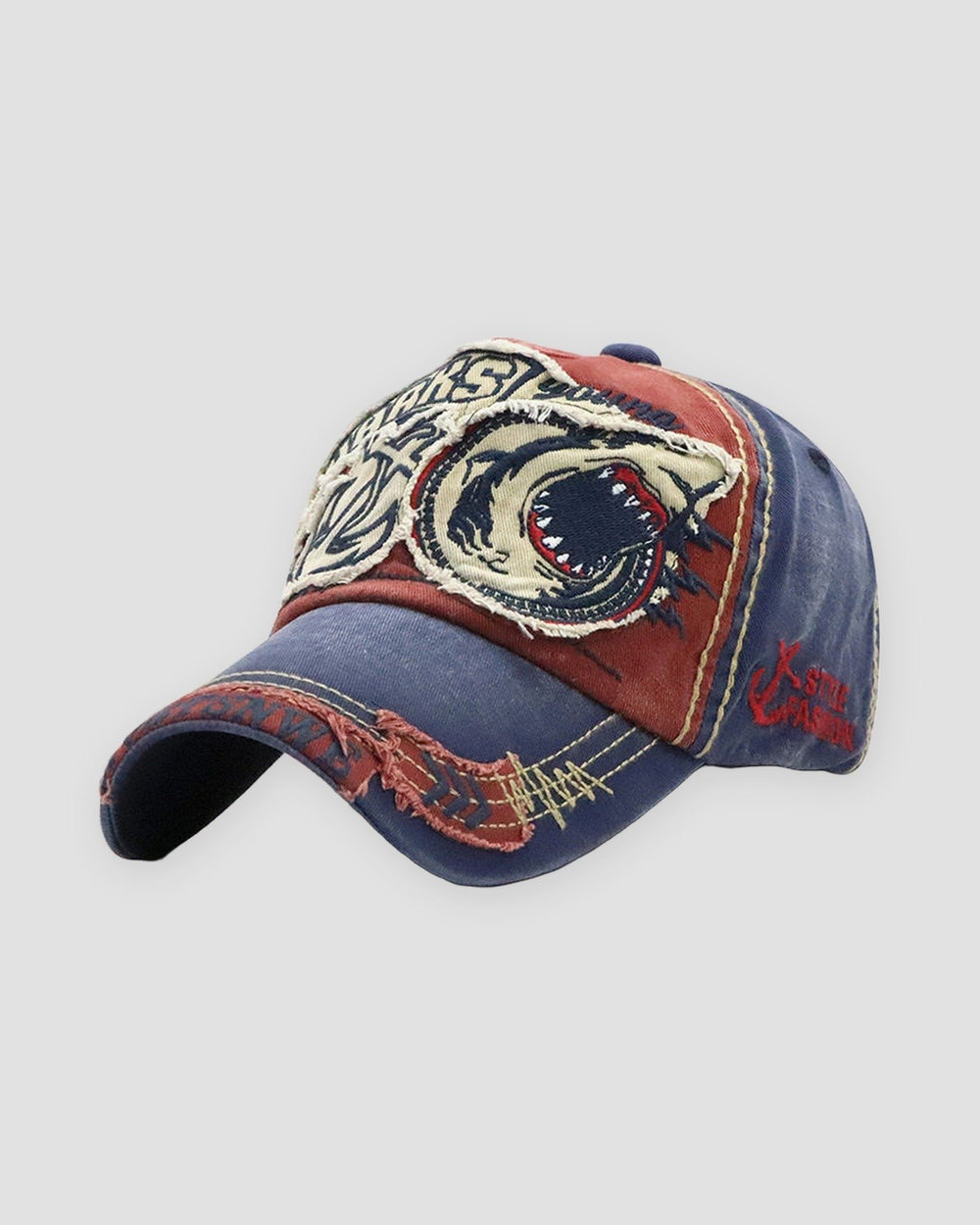 Wine red shark patch baseball cap, three-quarter view, navy brim