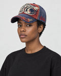 Model wearing the wine red shark patch cap, three-quarter view