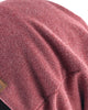 Close-up of the honeycomb-textured knit on the dusty red beanie