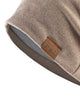 Close-up of the tan leather-look F&S patch and the textured knit on the khaki beanie