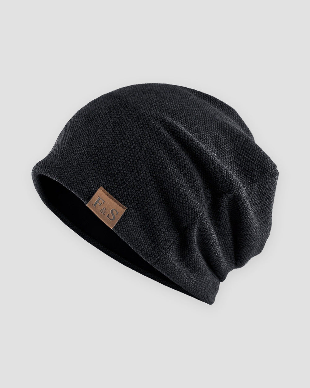 Black slouch beanie with a small tan F&S patch on the side
