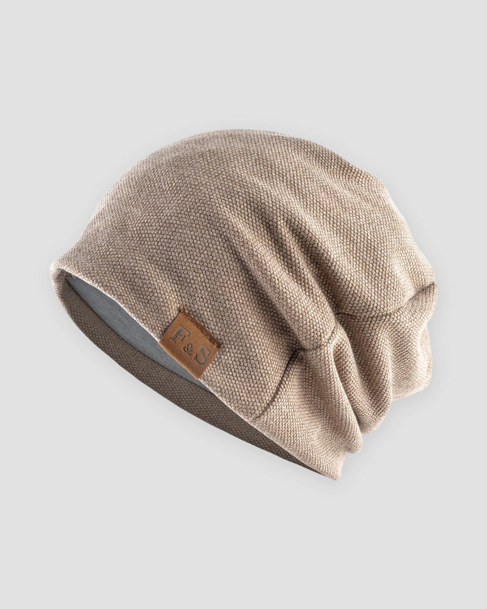 Khaki slouch beanie with a small tan F&S patch on the side