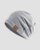 Light gray slouch beanie with a small tan F&S patch on the side