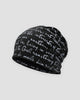 Black slouchy beanie printed all over with white handwritten cursive script