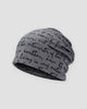 Dark gray slouchy beanie printed all over with black handwritten cursive script