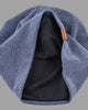Inside of the blue beanie, showing the dark inner layer