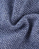 Close-up of the blue pebble-textured knit