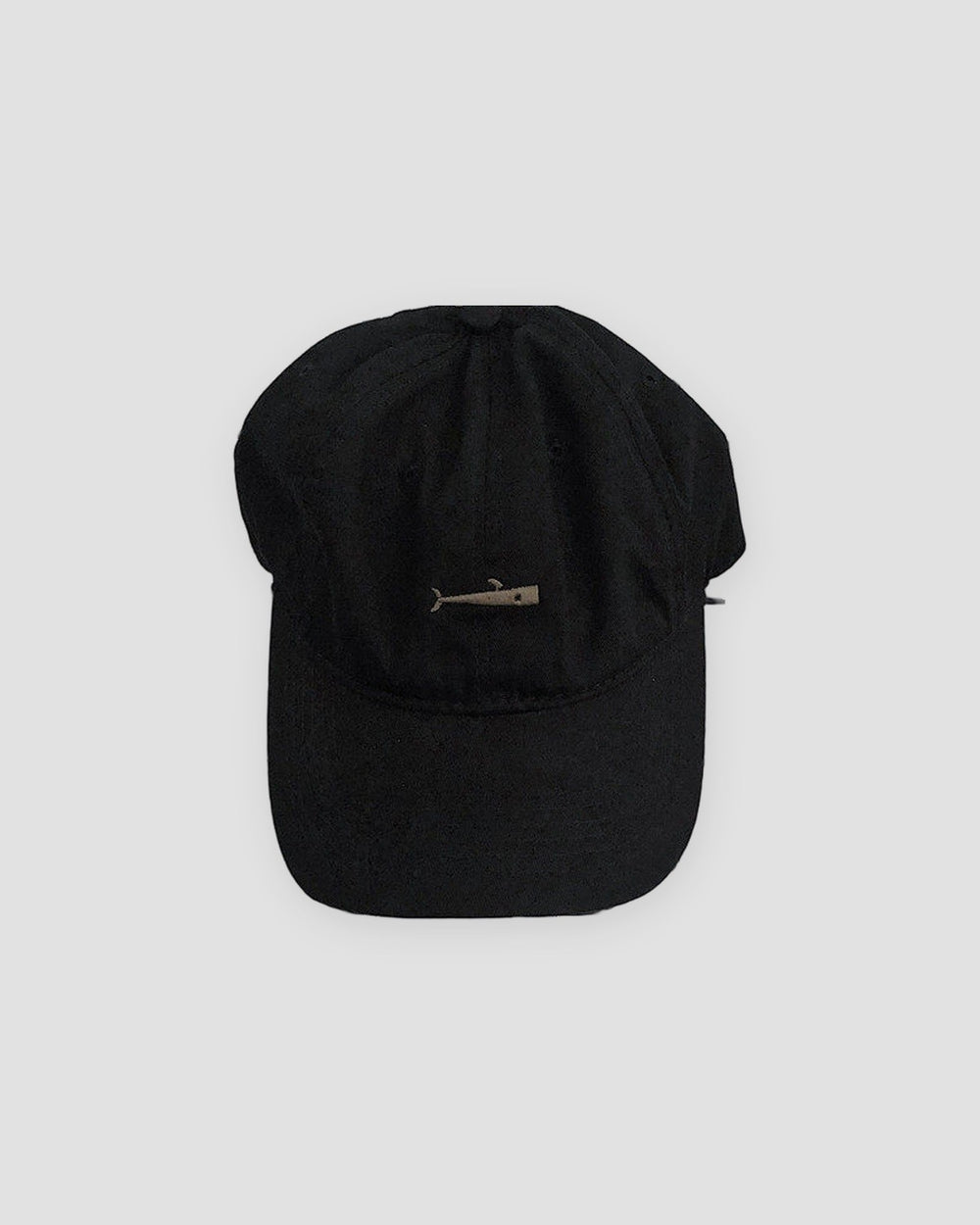 Black baseball cap with a small light gray whale embroidered at the front center