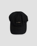 Black baseball cap with a small light gray whale embroidered at the front center