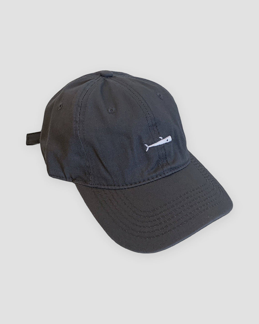 Dark gray baseball cap with a small white whale embroidered at the front center