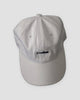 White baseball cap with a small black whale embroidered at the front center