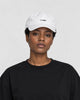 Model wearing the white whale cap with a black tee, side view