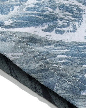 Close-up of the snowy mountain print and stitched hem