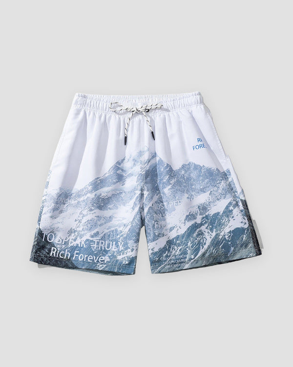 Snowy mountain print shorts, front view, blue mountain print rising from the hem