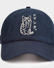 Front view of the navy cap with the white line-art cat and katakana on the crown