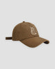 Brown baseball cap with a white embroidered seated cat and a line of katakana on the front