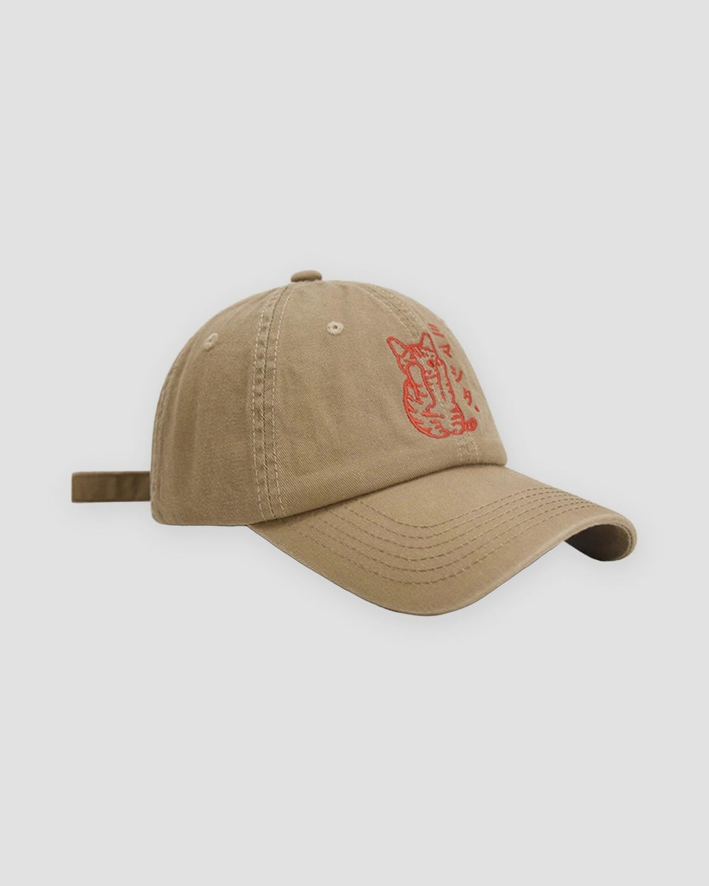 Khaki baseball cap with a red embroidered seated cat and katakana, three-quarter view