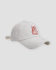 White baseball cap with a red embroidered seated cat and katakana, three-quarter view