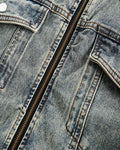 Close-up of the metal zip and snap flap chest pocket