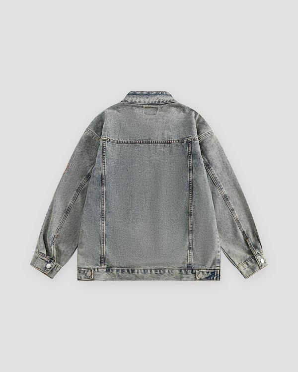 Gray-blue patch denim jacket, back view