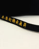 Close-up of the gold lettering along the long strap