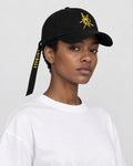 Model wearing the black Taoist talisman baseball cap, three-quarter view