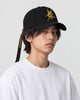 Model wearing the Taoist talisman embroidered cap, three-quarter view
