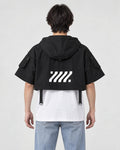 Model wearing the cropped hooded poncho top, back view of the large logo