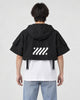 Model wearing the cropped hooded poncho top, back view of the large logo