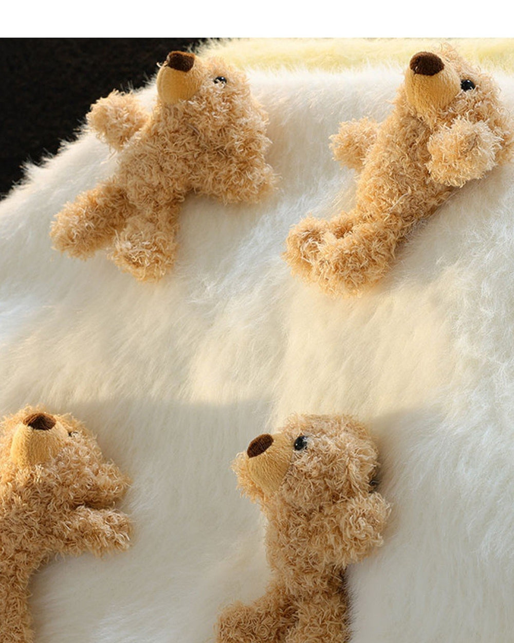 Close-up of the curly plush teddy bears on the fluffy knit