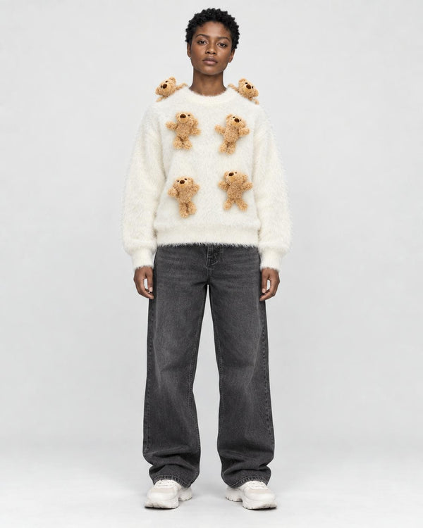 Model wearing the cream teddy bear sweater with black jeans, front view