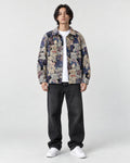 Model wearing the teddy bear jacquard overshirt open over a white tee, front view
