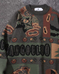 Close-up of the knitted teddy bear, acorns and lettering