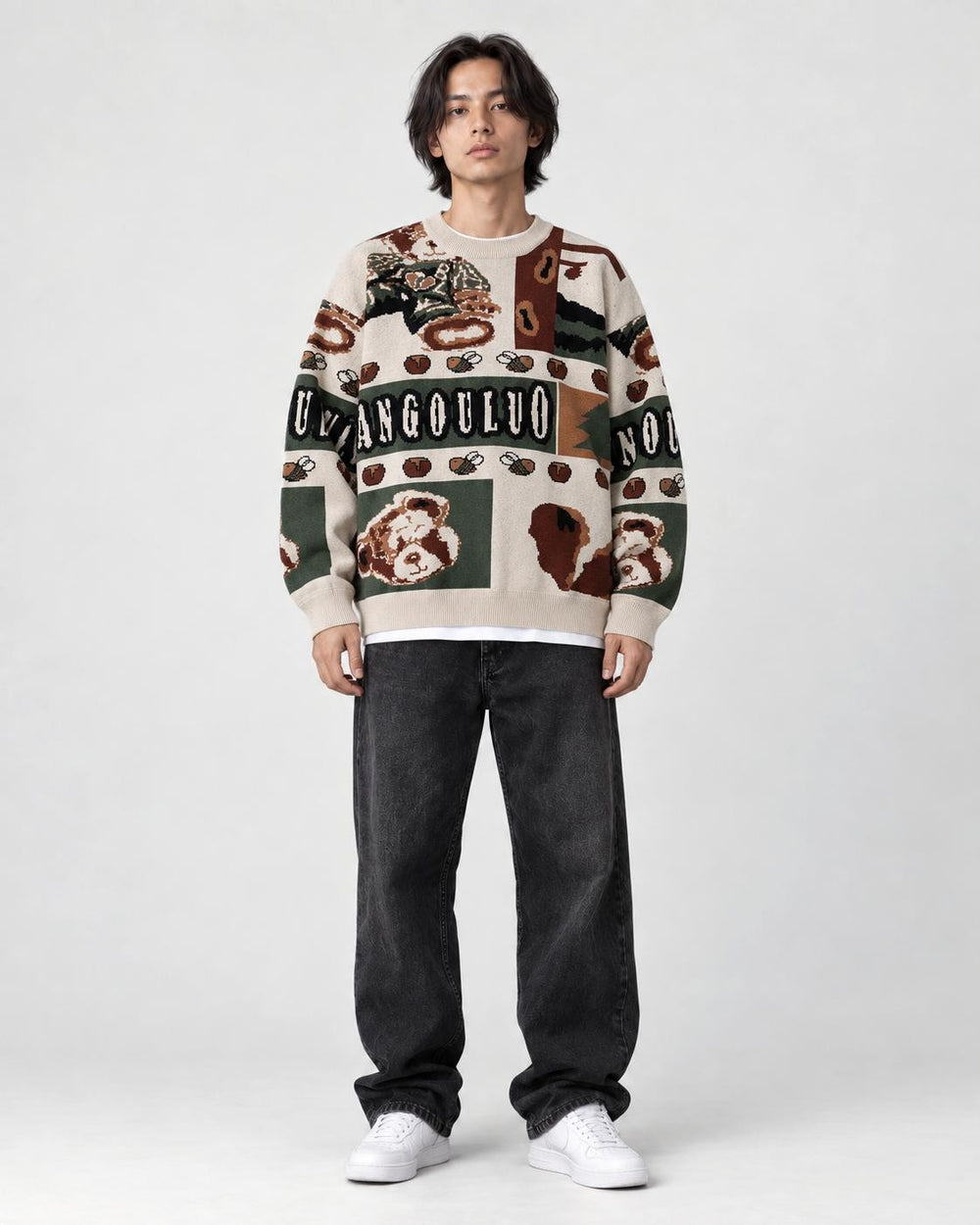 Model wearing the beige teddy bear patchwork sweater, front view