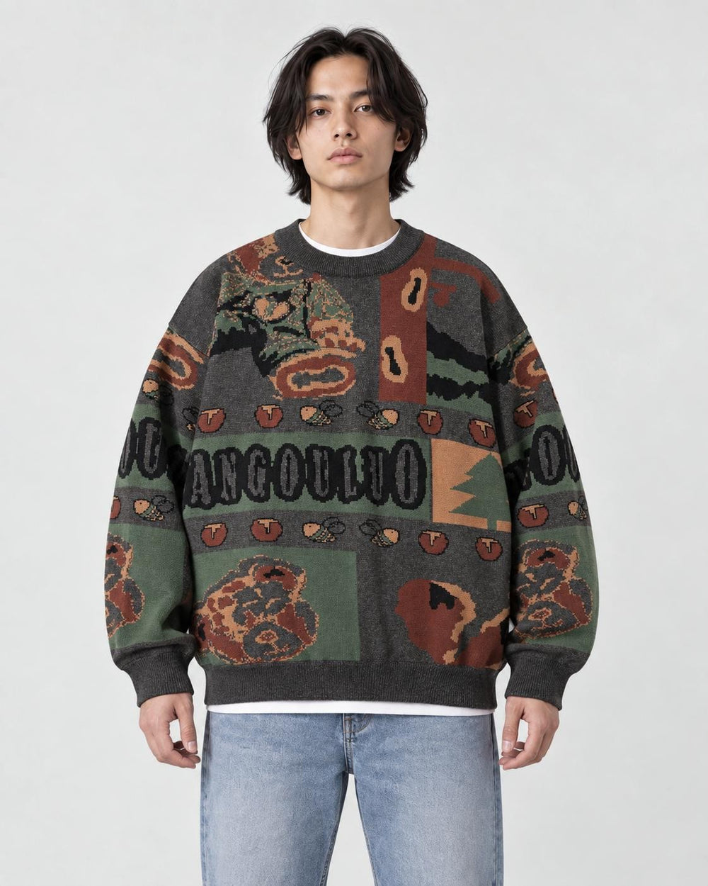 Model wearing the charcoal teddy bear jacquard sweater with jeans, front view