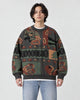 Model wearing the charcoal teddy bear jacquard sweater with jeans, front view