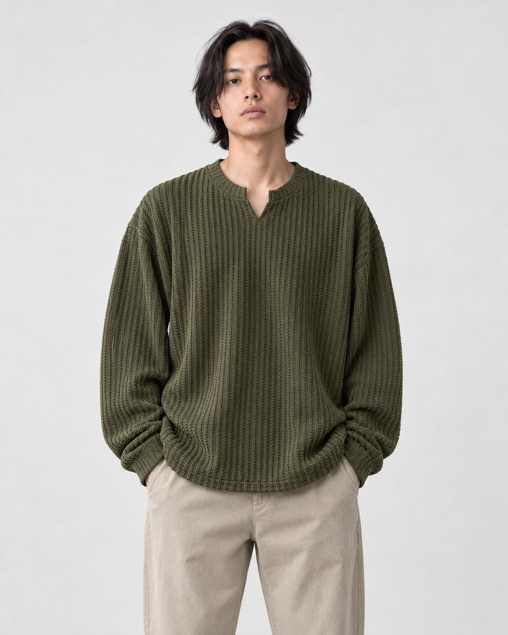 Model wearing the army green textured long sleeve tee with stone trousers, front view
