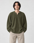 Model wearing the army green textured long sleeve tee with stone trousers, front view