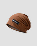 Brown slouchy beanie in a thin honeycomb knit with a small black woven label