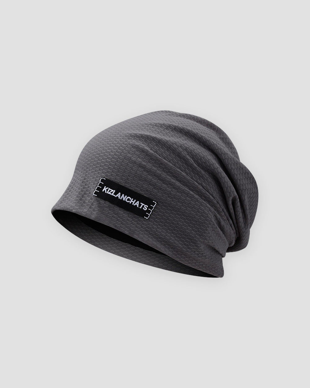Gray slouchy beanie in a thin honeycomb knit with a small black woven label