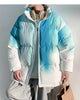 Blue-green and white tie-dye gradient puffer jacket with a stand collar, worn zipped