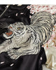 Close-up of the white tiger embroidery and pink blossoms on the front