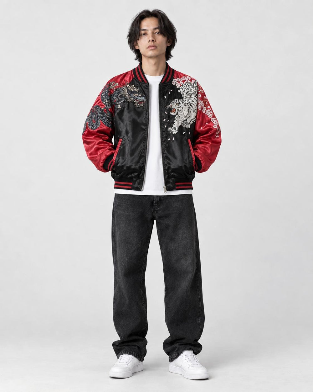 Model wearing the red sukajan open over a white tee, front view