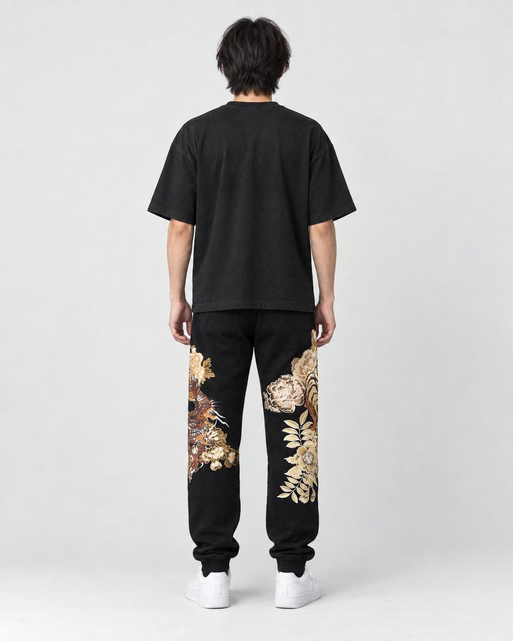 Model wearing the tiger dragon joggers, back view