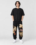 Model wearing the black tiger dragon embroidered joggers, front view