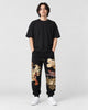 Model wearing the black tiger dragon embroidered joggers, front view