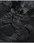 Close-up of the black-on-black dragon embroidery