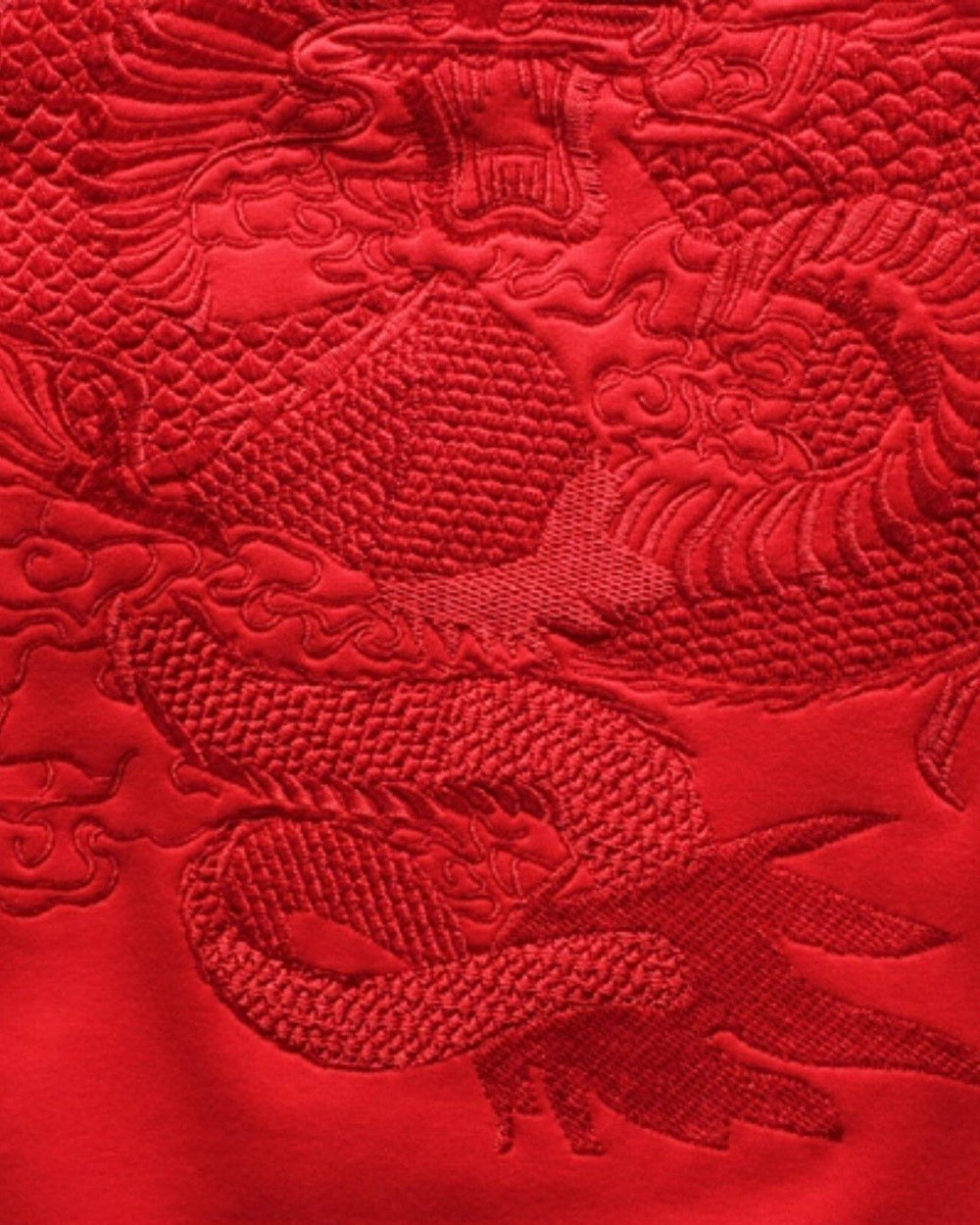 Close-up of the red-on-red dragon embroidery