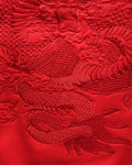Close-up of the red-on-red dragon embroidery